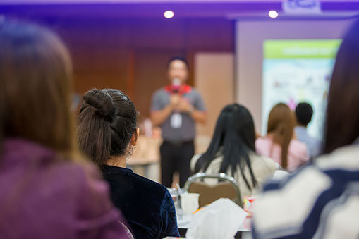 Photo of Audience Listening to Speaker